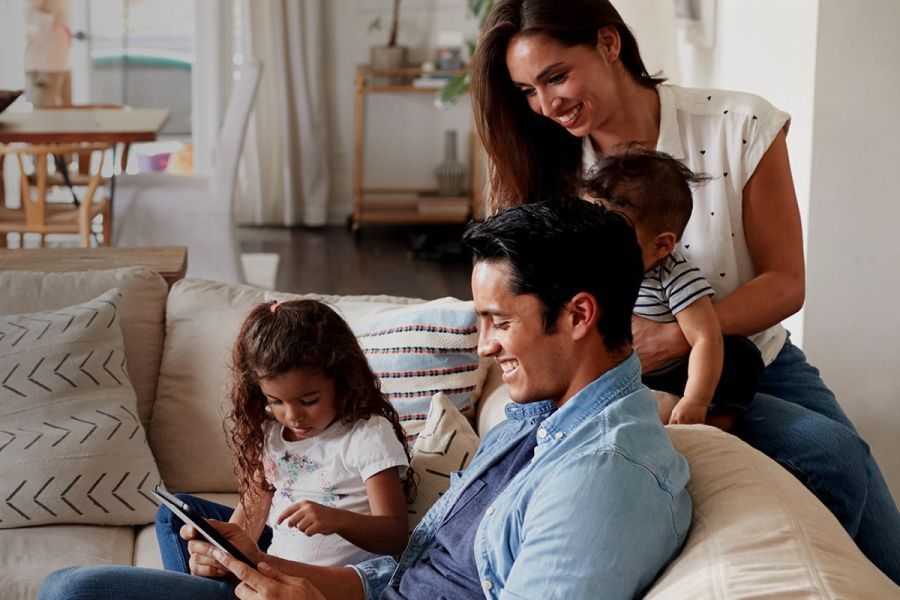 Family reaping the benefits of a new furnace while enjoying quality time in their warm house.